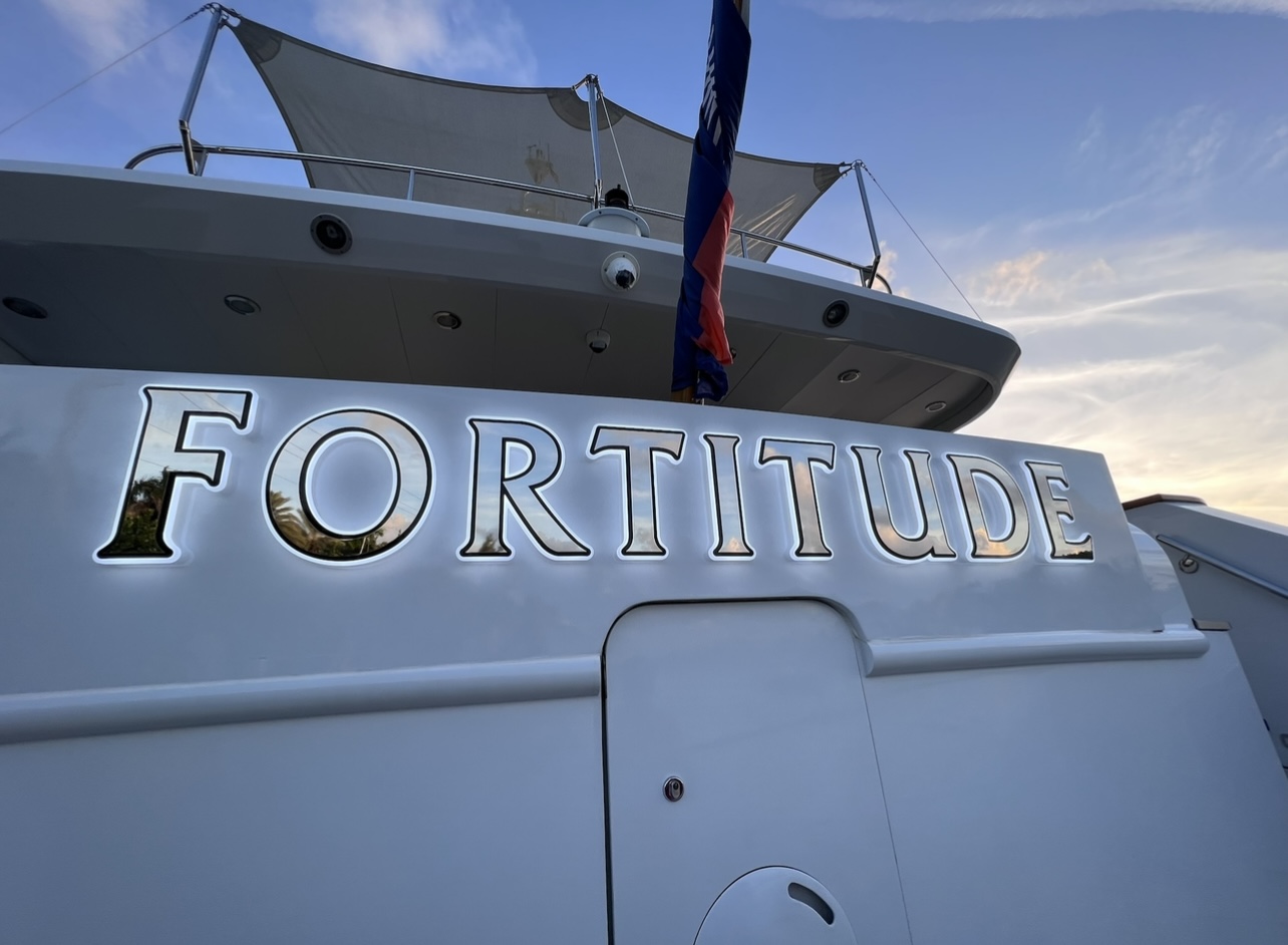 Motor yacht FORTITUDE stainless backlit lettering on a super yacht.